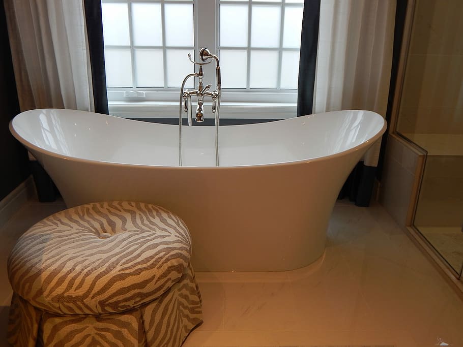 white ceramic freestanding bathtub beside zebra print suede ottoman, HD wallpaper