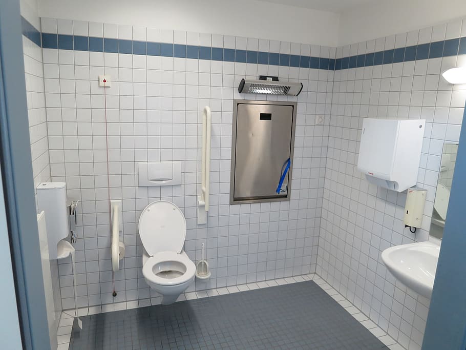 white ceramic flush toilet near white ceramic sink, wc, barrier  toilet