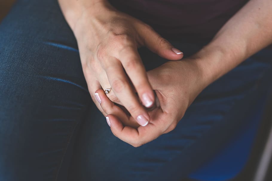 person holding silver-colored ring on ring finger, diamond HD wallpaper