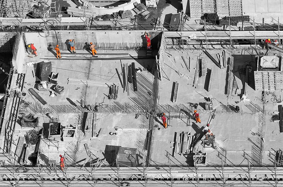 selective color photo of man on top of gray building, aerial photography of person working to build a building HD wallpaper