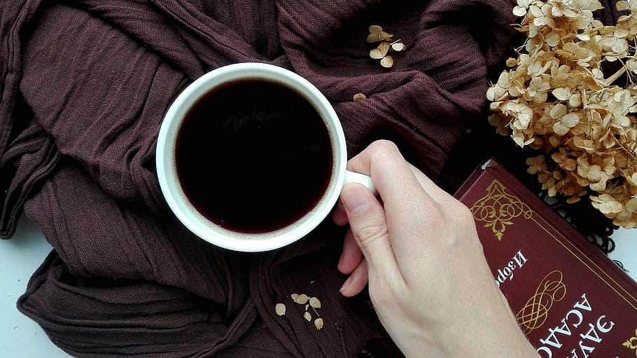person holding filled white ceramic mug, coffee, drinks, reading HD wallpaper