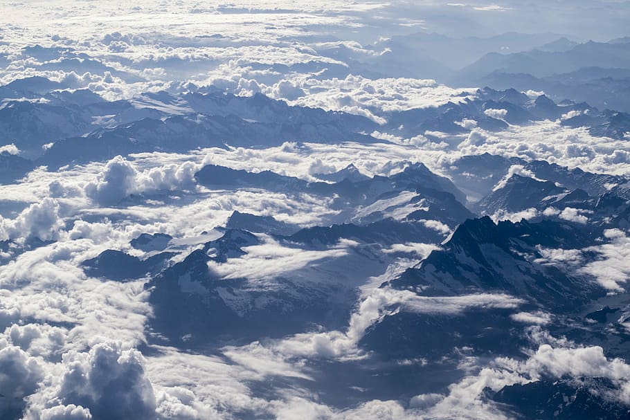 aerial photo of gray mountains covered with snow, clouds, daytime HD wallpaper