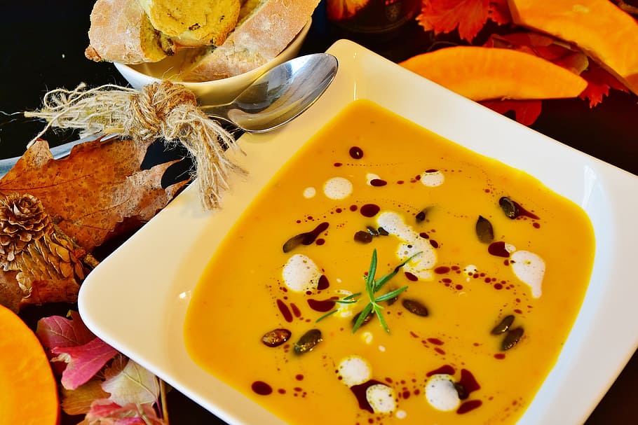 square white ceramic plate with soup, pumpkin soup, hokkaido