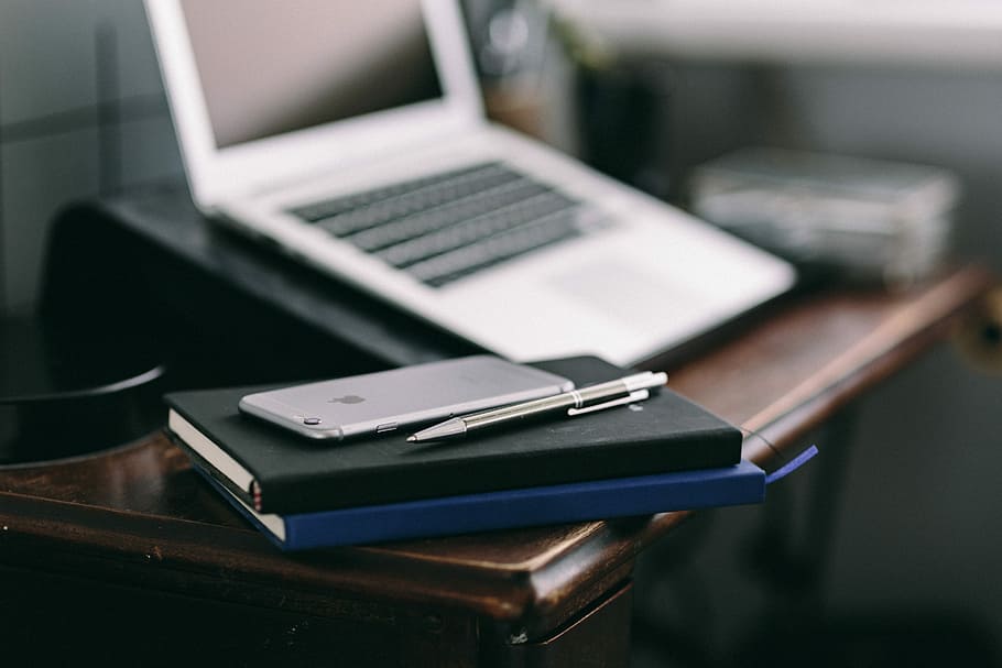 Elegant workspace with Macbook, iPhone, business cards and notebooks HD wallpaper