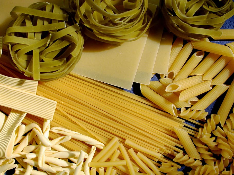 Premium Photo | Assorted varieties of pasta wallpaper. mix macaroni,  spaghetti with blank space for text