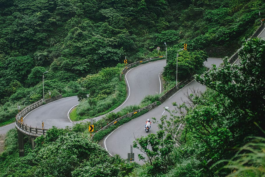 Jiufen, motorcycle travelling on concrete road surround by trees, HD wallpaper