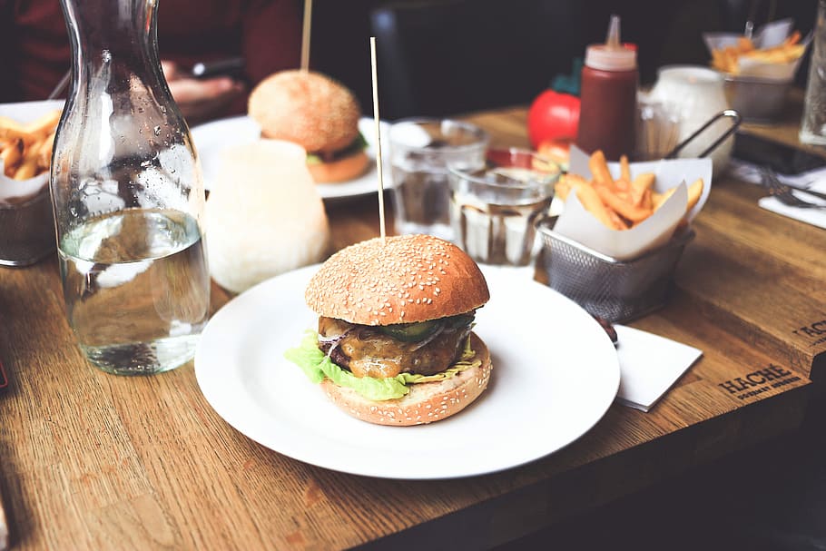 burger with cheese and veggies on white ceramic plate, hamburger HD wallpaper