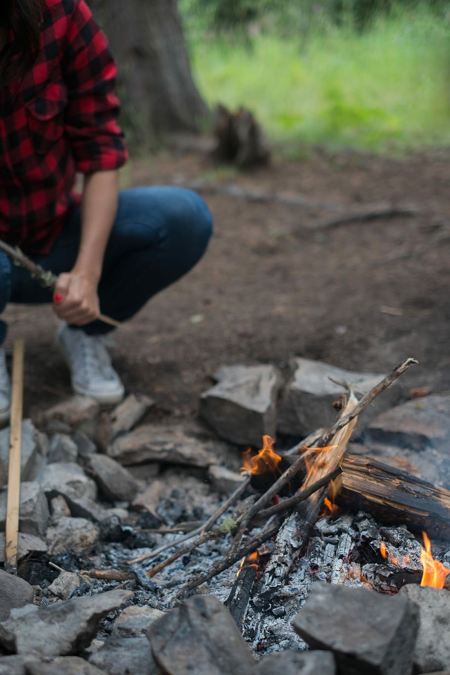 depth photography of bonfire, person in blue denim pants burning woods HD wallpaper