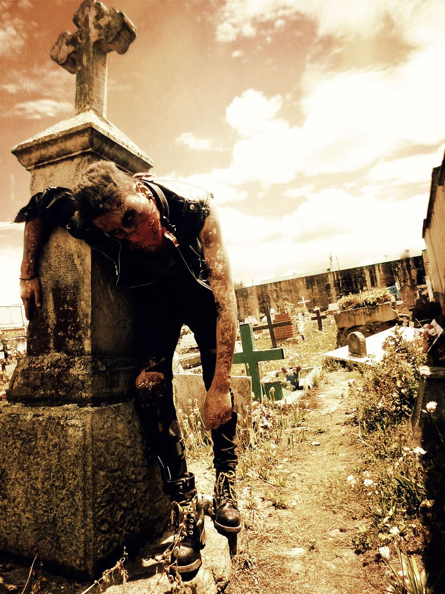 man wearing vest leaning on tomb, zombie, death, cementary, halloween