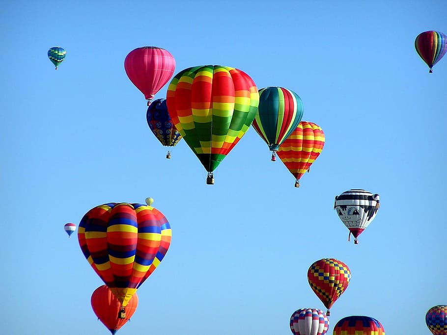 assorted-color hot air balloons floating at daytime, hot-air ballooning