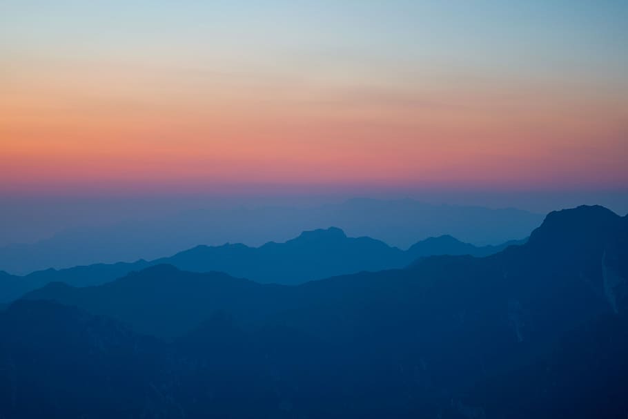 mountain during golden hour, in distant silhouette of mountain HD wallpaper