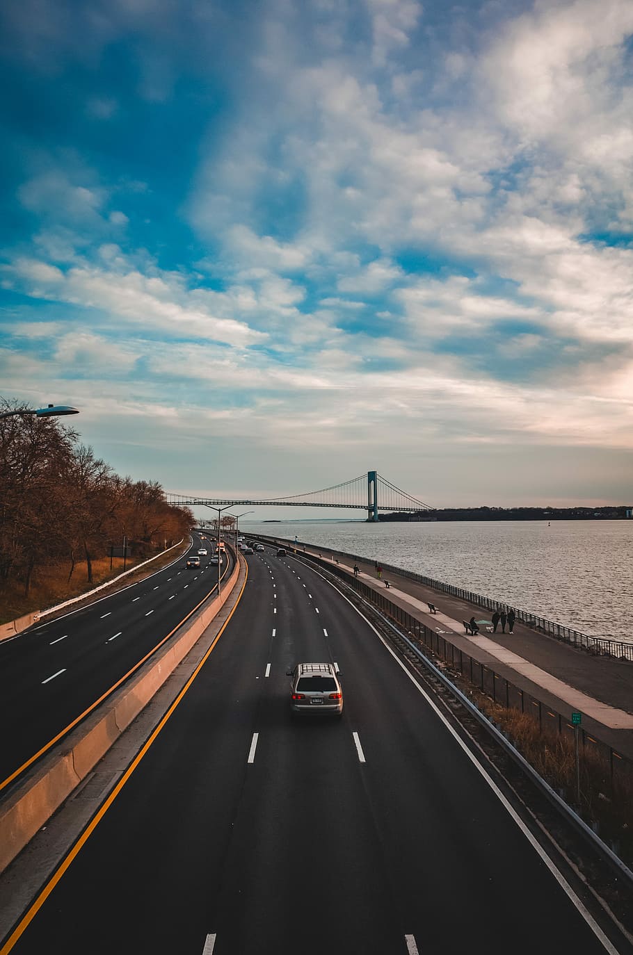 car on road near body of water, gray SUV on road, highway, sky HD wallpaper