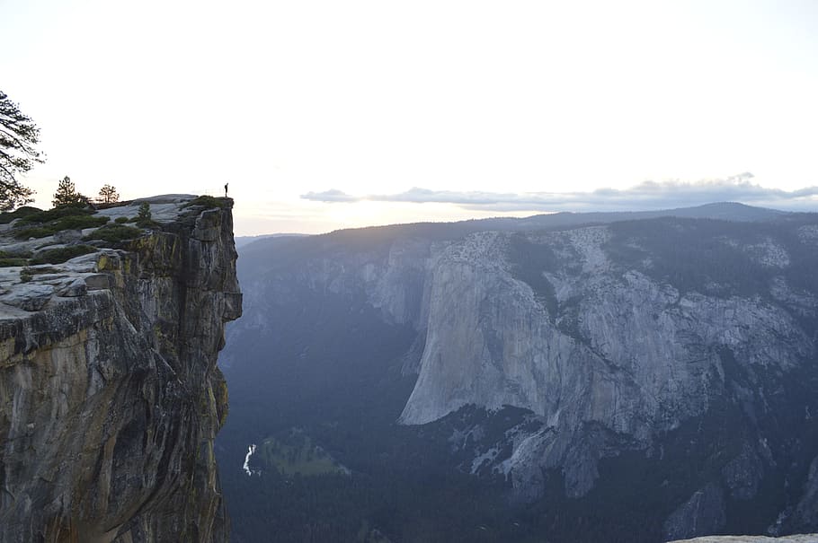 body of mountain during daytime, gray and green mountain and cliff at daytime HD wallpaper