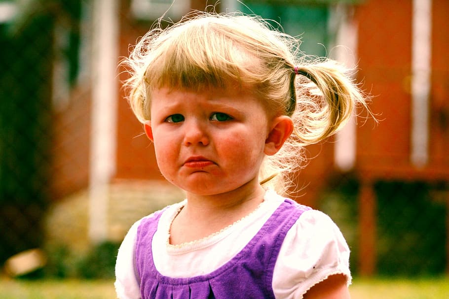 girl wearing purple and white top, baby, child, pouting, temper tantrum