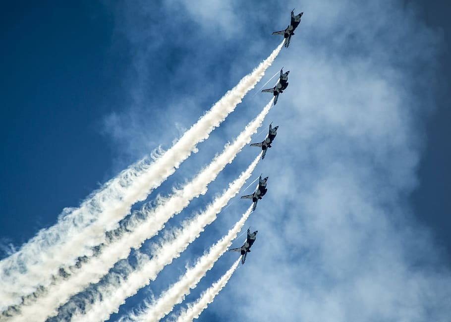 time lapse photography of five plane contrails, air show, thunderbirds