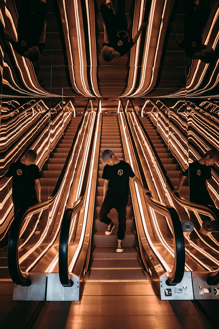 man standing on escalator with string lights, man riding escalator, HD wallpaper