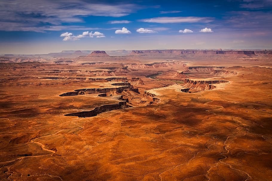 aerial photo of brown sand under blue sky at daytime, canyonlands national park