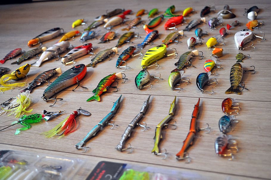 close-up photo of assorted-color fish lure lot on brown wooden surface, HD wallpaper