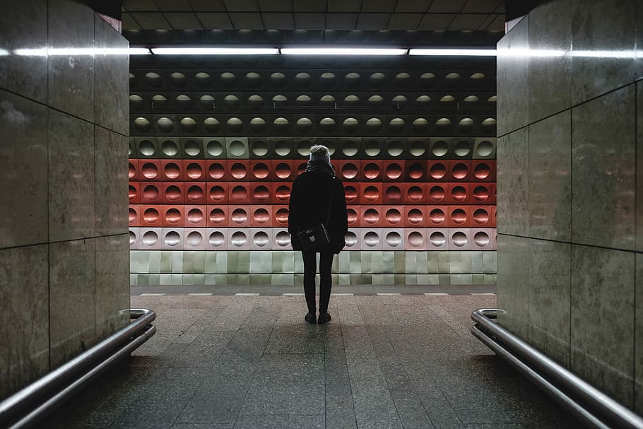 person standing on train station, person standing between two pathways HD wallpaper