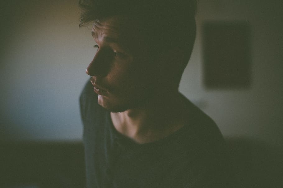 man in black shirt inside room, man wearing black crew-neck top HD wallpaper