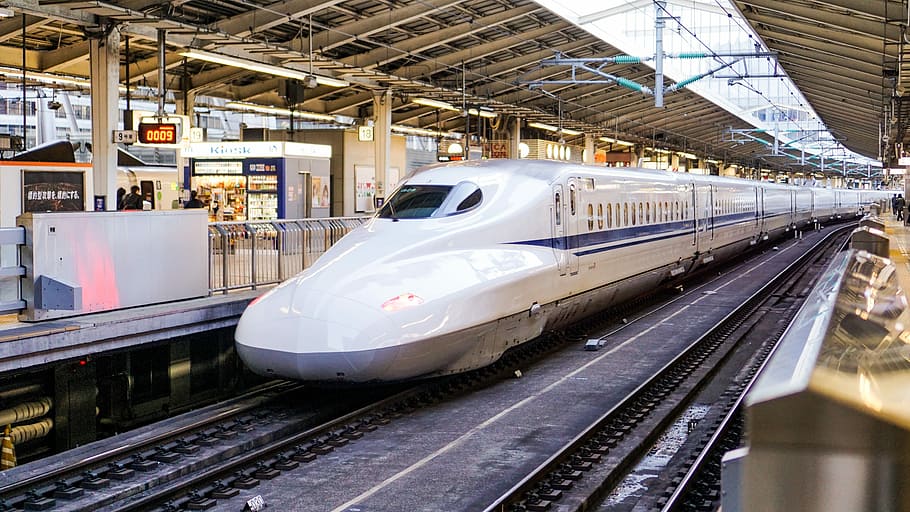 time lapse photography of white train, white and blue bullet train HD wallpaper