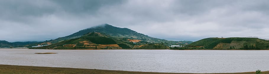 Green Mountain Beside Ocean during Cloudy Day, clouds, daylight HD wallpaper