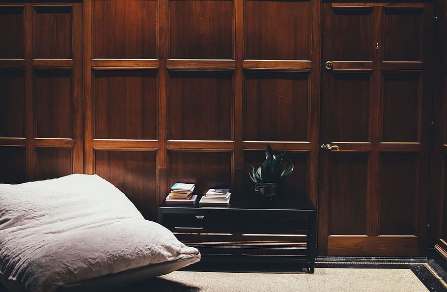 beige throw pillow, black wooden side table near white mattress in roomk, HD wallpaper