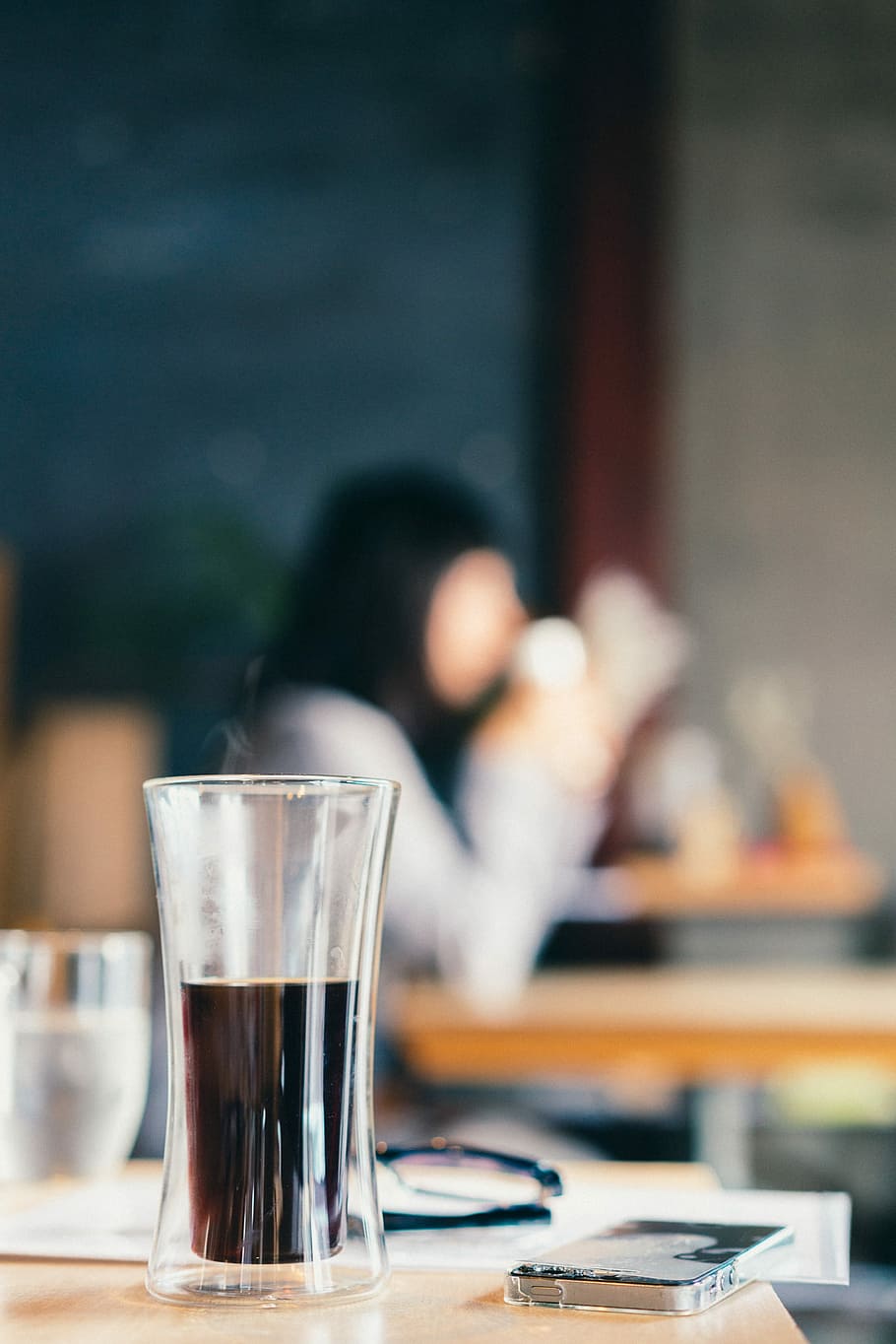 shallow focus photo of drinking glass with liquor, selective focus photo of cylindrical drinking glass with black liquid inside HD wallpaper