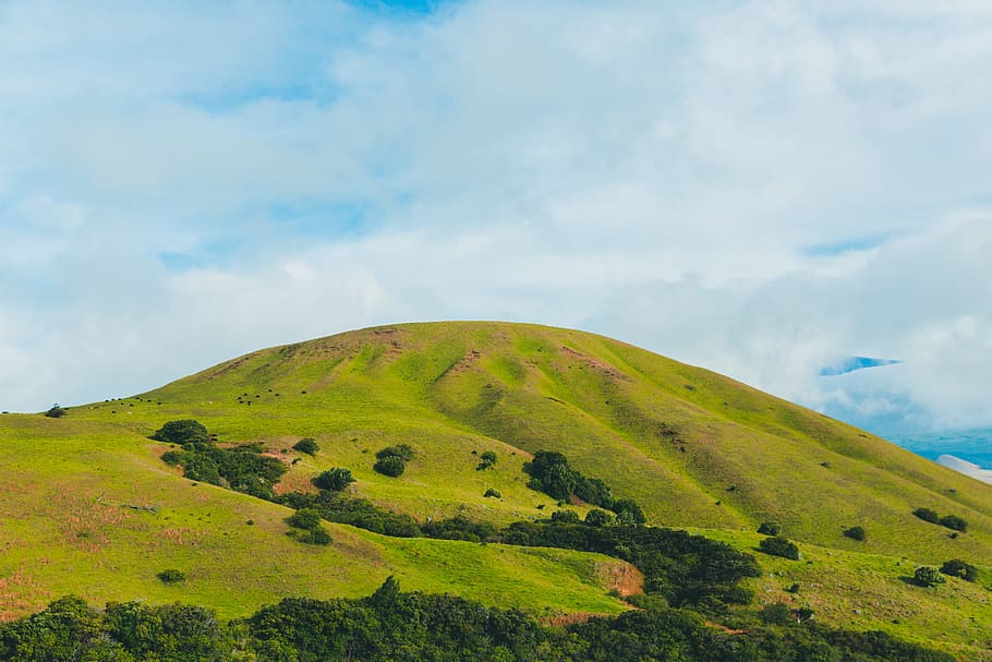 green mountain, green mountain under white clouds at daytime HD wallpaper