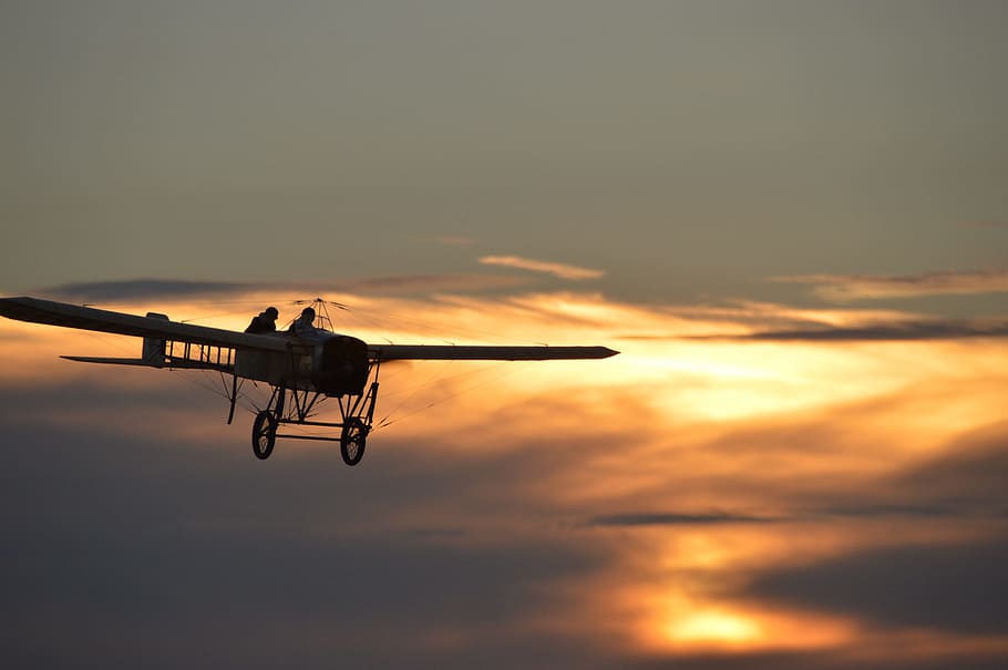 flying biplane during golden hour, oldtimer, blériot, aircraft