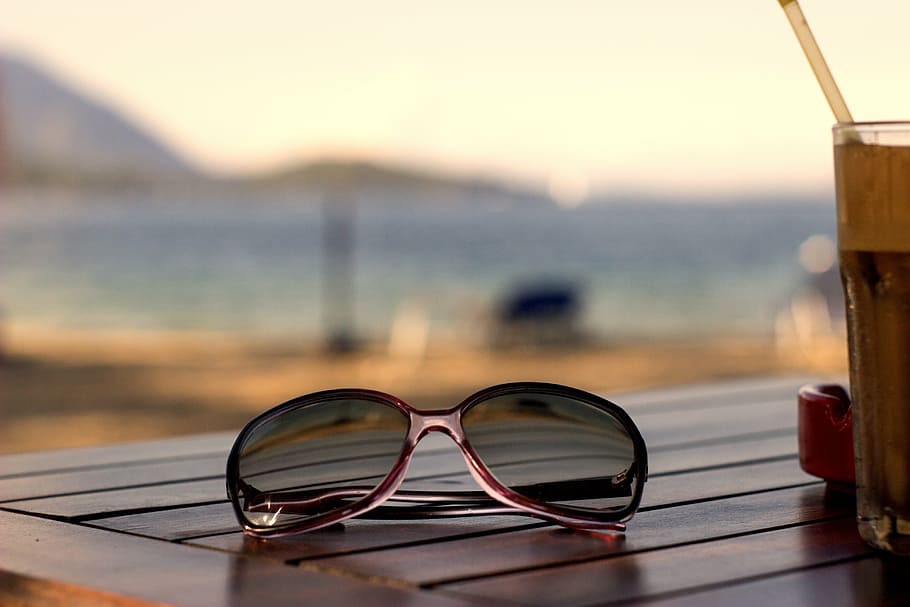 selective focus photography of aviator-style sunglasses on wooden table, HD wallpaper