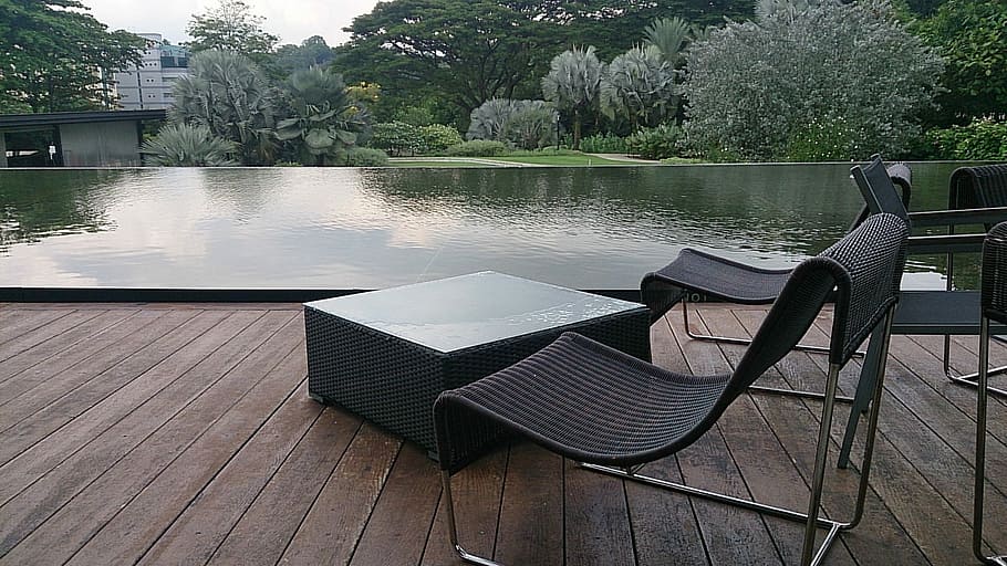black patio chairs beside body of water, furniture, outdoors HD wallpaper