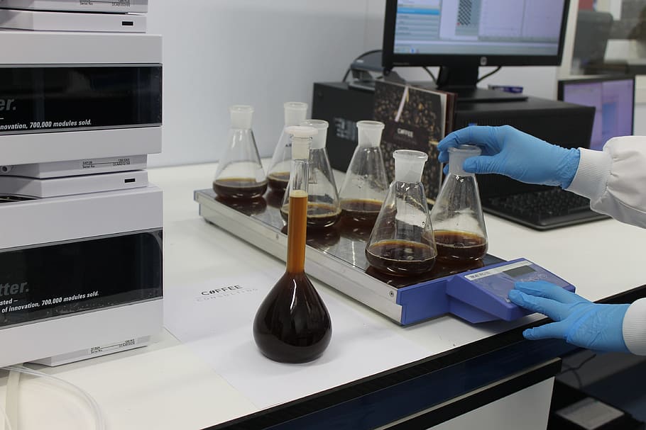 Erlenmeyer flasks on table near monitor, lab, coffee, caffeine HD wallpaper