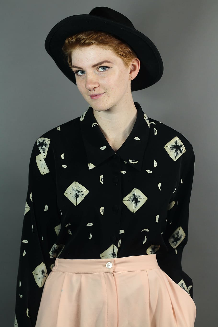 woman wearing black and white button-up long-sleeved collared shirt