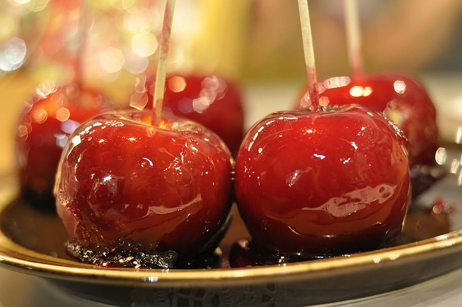 selective focus photo of cherry fruits, candy, apples, caramel
