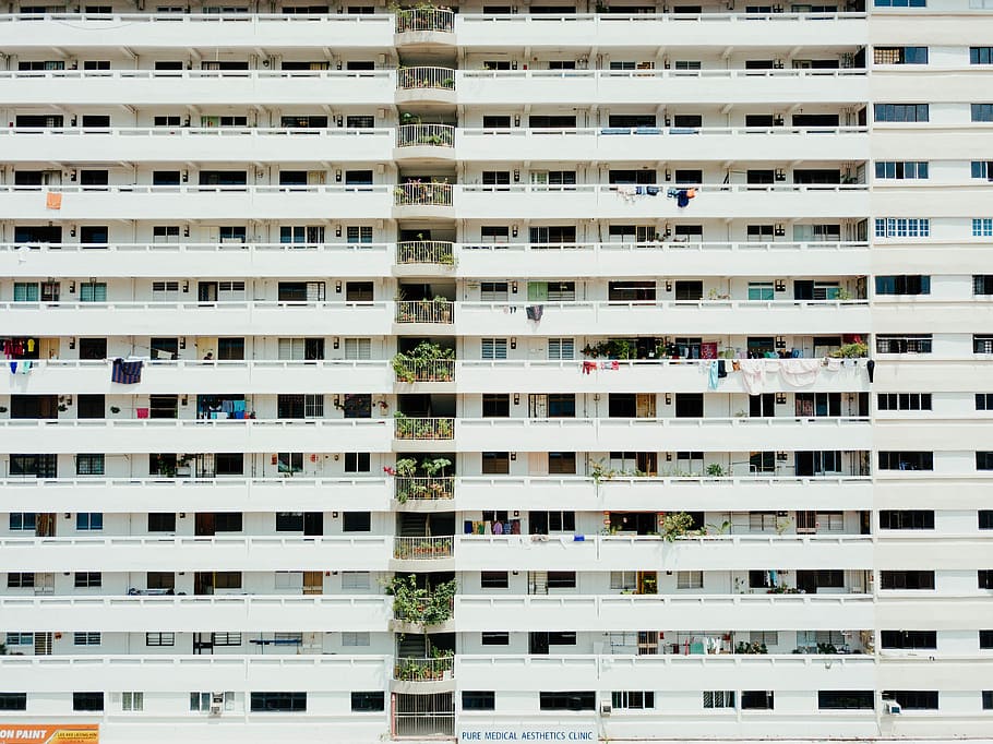 white concrete building aerial photography, concrete buildings with balconies during day HD wallpaper