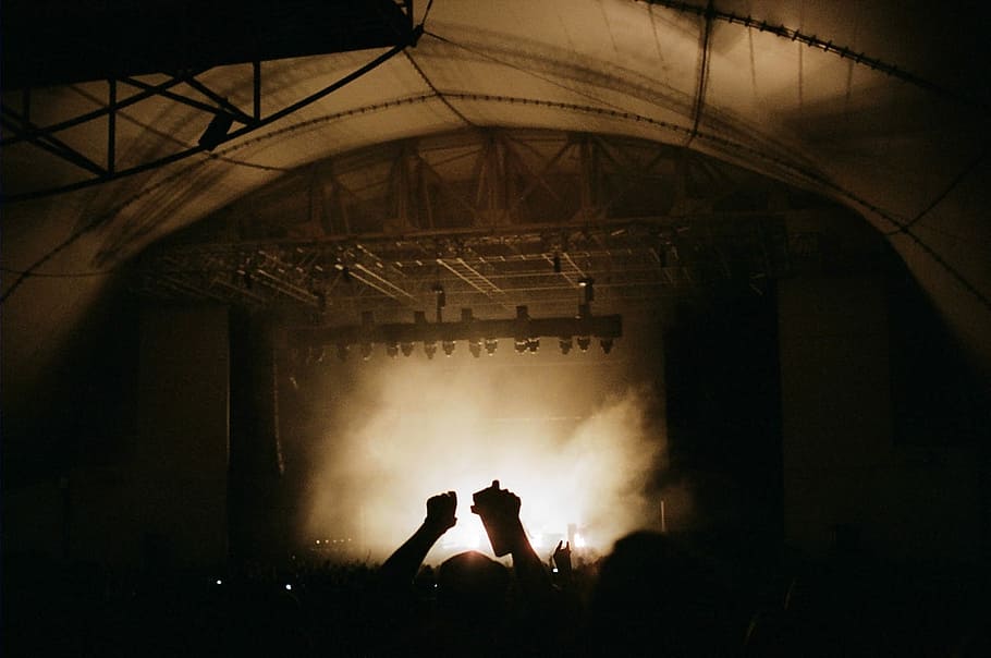 silhouette photography of group of people on concert, dark stage