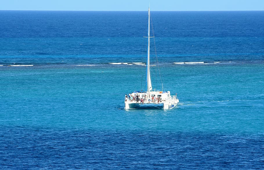 white sailboat on open water during daytime, caribbean, sea, beach