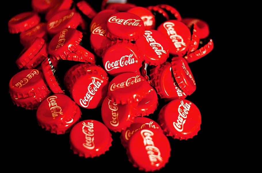 pile of red Coca-Cola bottle crowns, coca cola, crown corks, soft drink