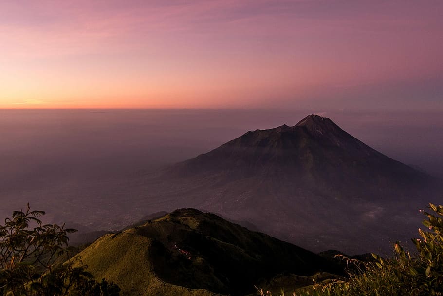 gray mountain under gray sky during sunset, landscape photography of black mountain HD wallpaper