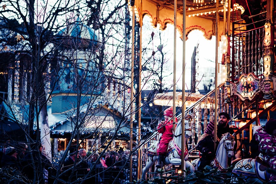 Christmas in Tivoli Gardens, people near trees beside concrete house during daytime HD wallpaper
