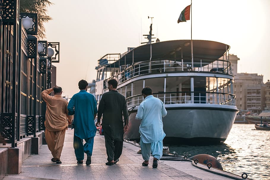four men standing near ship, arab, arabic, back, culture, dubai, HD wallpaper