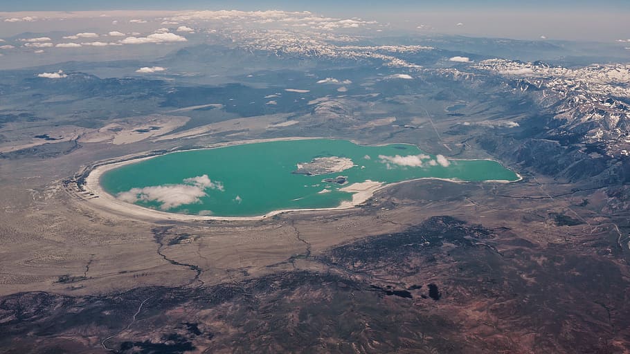 aerial photography of island at the center of island, aerial photography of lake at day time HD wallpaper