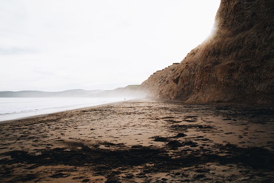 coast, shore, beach, ocean, water, sea, sand, cliff, mountain HD wallpaper