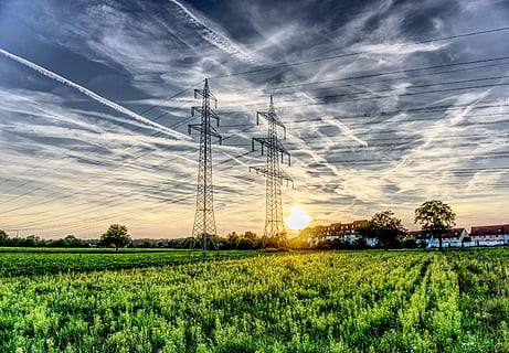 photo of two gray transistor towers during daytime, sunset HD wallpaper