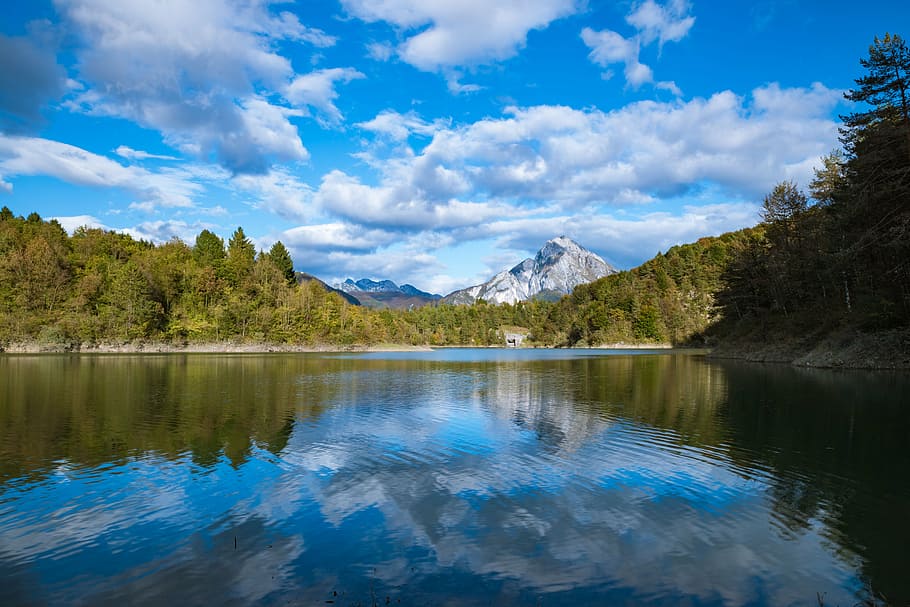 lake in the middle of trees and mountains, reflections, water HD wallpaper