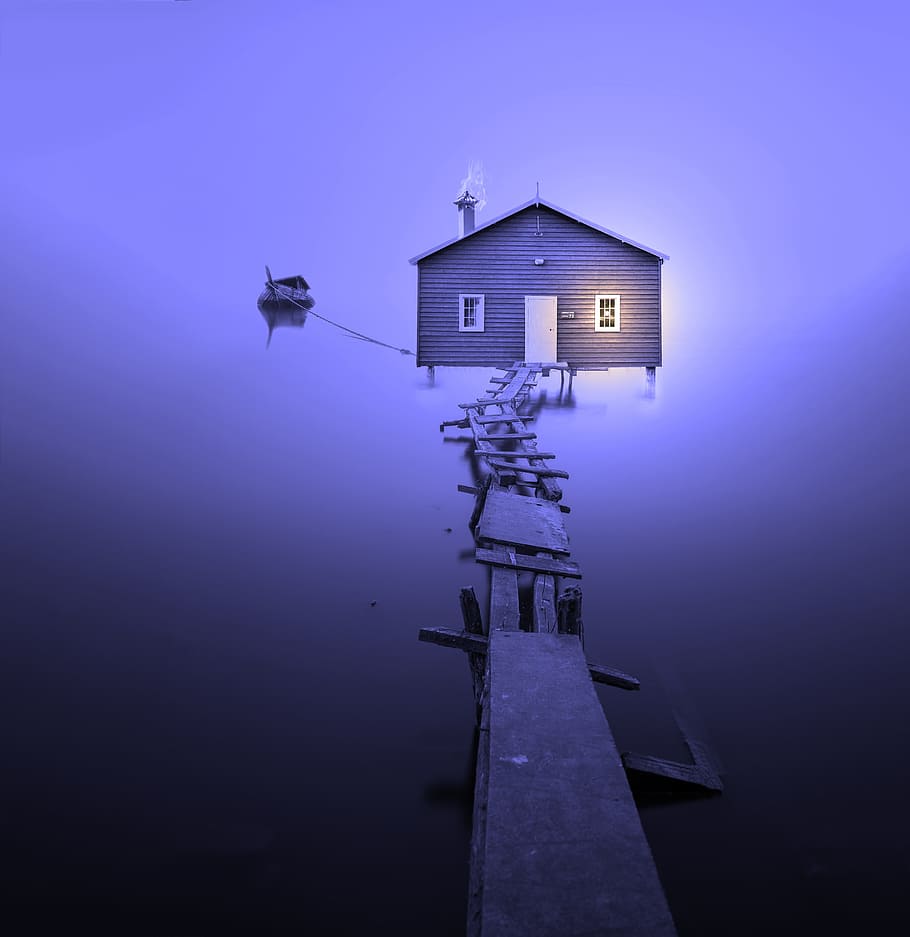 brown wooden house with wooden dock under purple sky, boat house
