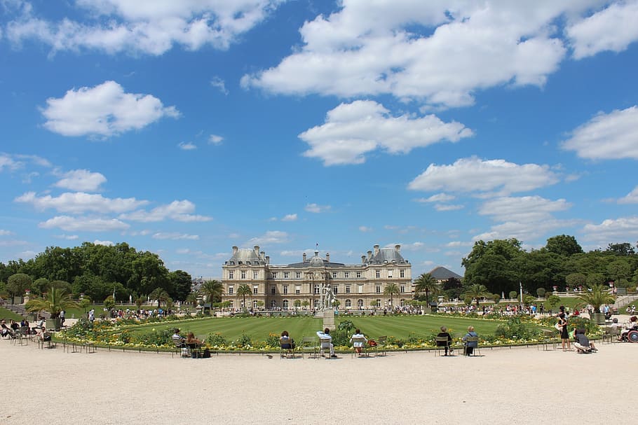 group of people beside grass field near building, luxembourg palace