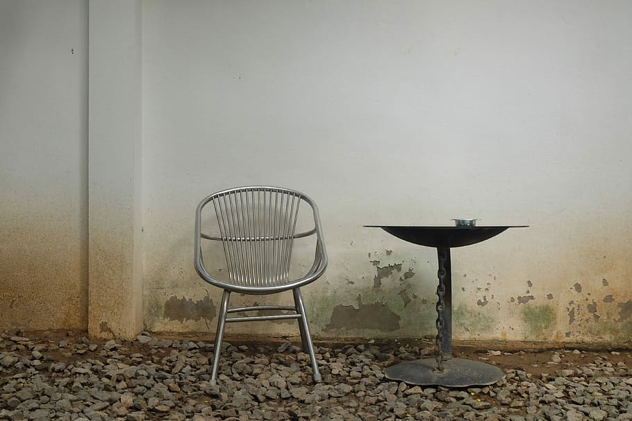 round black metal table beside gray metal chair, coffee, interior