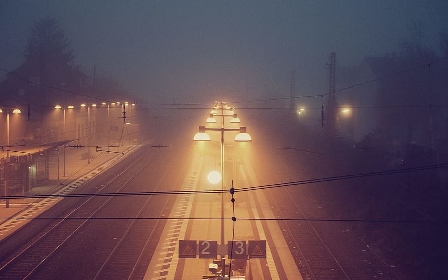 turned on street lights during nighttime, post light between two roads HD wallpaper